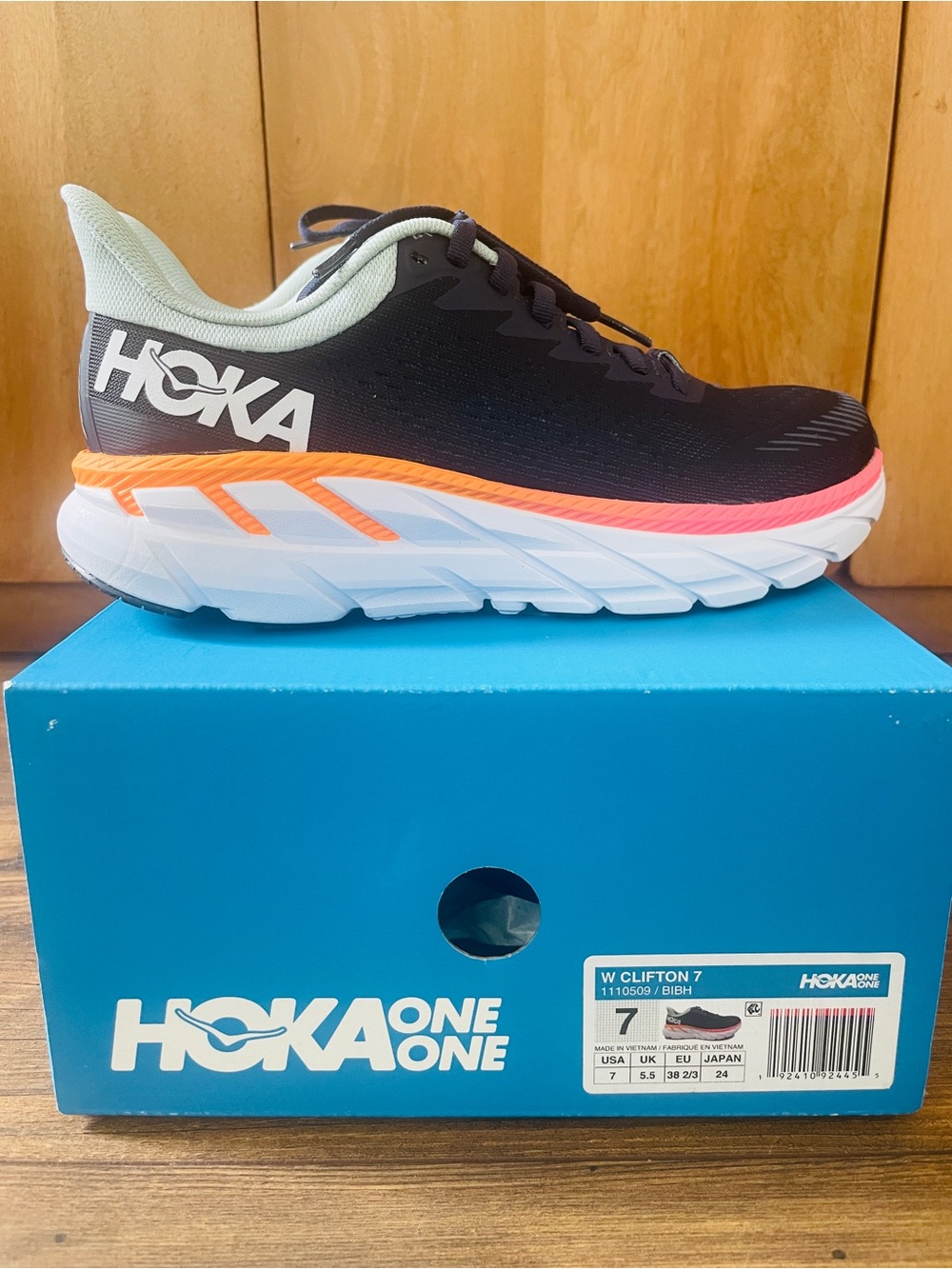 Hoka One One Women’s Navy with Light Blue & Orange Accent Running Sneaker